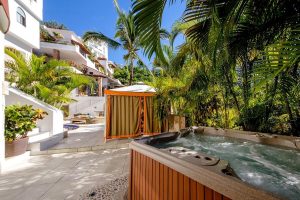 Casa Cupula, a gay-friendly hotel. Hot tub and cabana surrounded by lush greenery. Perfect for gay travel in Puerto Vallarta.