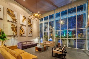 City Express Plus by Marriott Ciudad de Mexico Reforma El Angel lobby. Gay-friendly hotel with modern design, art, and comfortable seating.