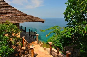 Imanta Resorts Punta De Mita gay-friendly hotel view. Ocean view from a thatched-roof villa. Tropical getaway for gay men's travel.