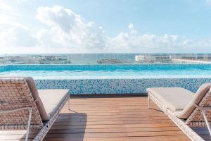 Rooftop pool at The Reef 28 Hotel & Spa, a luxury adults-only all-suites hotel with optional all-inclusive packages; gay-friendly resort.