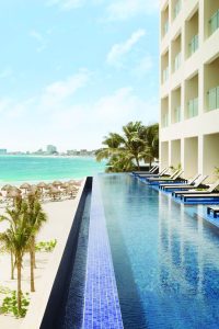 Turquoize at Hyatt Ziva Cancun adults-only all-inclusive resort. Infinity pool overlooking the beach. Gay-friendly hotel in Cancun, Mexico.