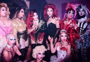 Peach Hanoi: Drag queens pose at a gay bar in Hanoi, Vietnam. Fabulous makeup, wigs, & costumes. Gay travel nightlife.
