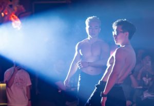 Shirtless dancers at Z9 Bar, a gay bar in Ho Chi Minh City, Vietnam. Nightlife and travel for gay men. Spotlight on stage.