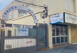 Apolo Sauna Cabaret, a gay sauna in Torremolinos. Entrance to the gay venue with signs in Spanish and English. A popular spot for gay men's travel.