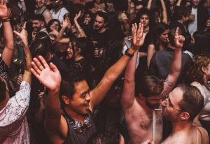 Crowd at Glitterbox @ Hi Ibiza gay club. People dancing with hands up. Ibiza nightlife. Gay travel destination.