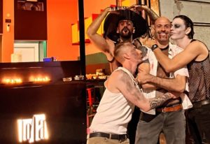 LOLA Milan bar: Group of gay men in costume, celebrating Halloween in Milan's gay district. Nightlife for gay travelers in Italy.
