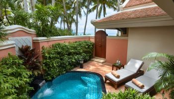 Santiburi Koh Samui deluxe beachfront villa plunge pool. Private plunge pool, sun loungers, and lush tropical garden. Gay travel luxury.