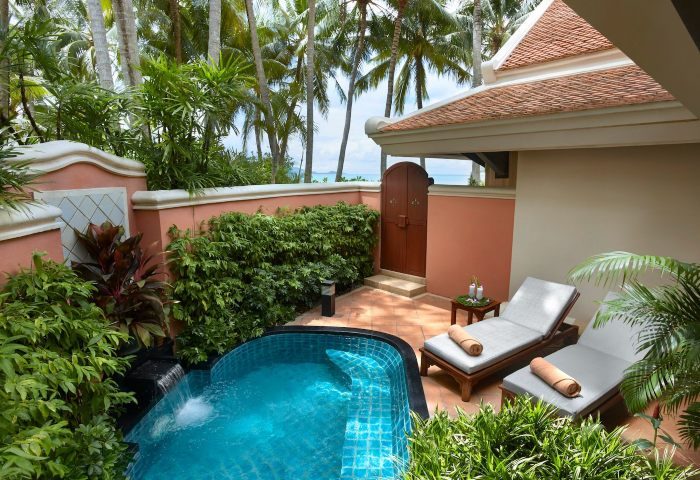 Santiburi Koh Samui deluxe beachfront villa plunge pool. Private plunge pool, sun loungers, and lush tropical garden. Gay travel luxury.