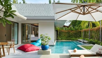 Santiburi Koh Samui Grand Reserve Pool villa. Luxury gay travel. Private pool, lounge chairs, and bean bags create a relaxing tropical retreat.