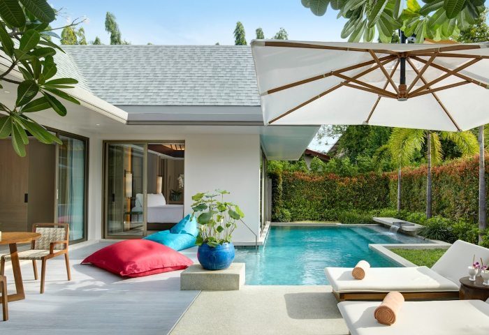 Santiburi Koh Samui Grand Reserve Pool villa. Luxury gay travel. Private pool, lounge chairs, and bean bags create a relaxing tropical retreat.