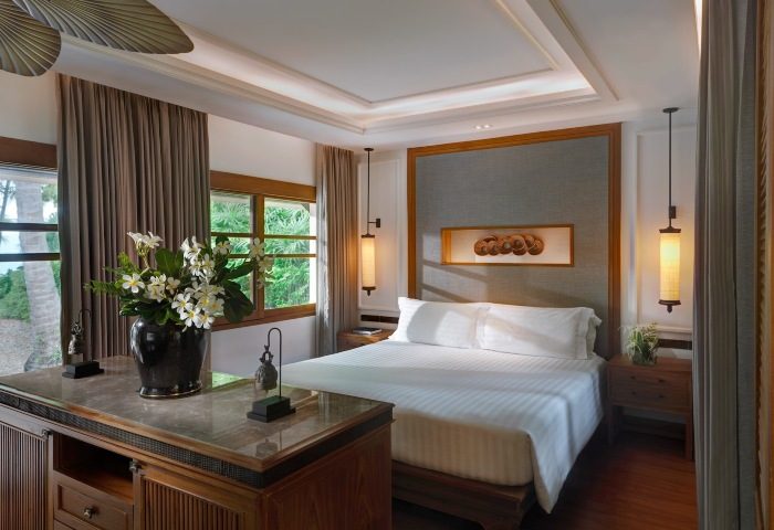 Santiburi Koh Samui's Grand Deluxe Beachfront Villa bedroom. Two-bedroom villa with private pool. Luxury gay travel in Thailand. Maenam beachfront.