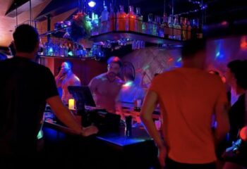 Gay bar scene: Men at the bar in Twist. Nightlife, travel advice, and entertainment for gay men. 1-28.jpg.