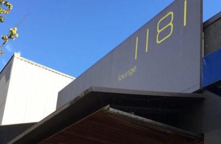 1181 Lounge sign in Vancouver. Gay travel advice for Vancouver's nightlife. Popular gay bar with a lounge. Vancouver's best gay bar.