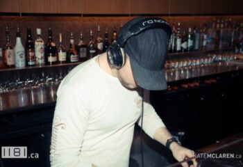 DJ at 1181 Lounge in Vancouver. A gay bar with a DJ playing music. Vancouver's nightlife is vibrant and inclusive. Gay travel advice.