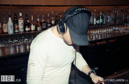 DJ at 1181 Lounge in Vancouver. A gay bar with a DJ playing music. Vancouver's nightlife is vibrant and inclusive. Gay travel advice.