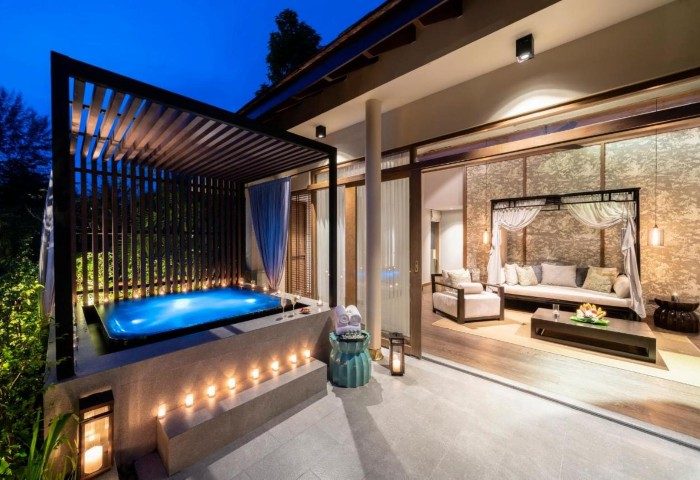 The Sarojin Khao Lak resort's suite with a private jacuzzi. Candles light up the area. Luxurious gay travel in Thailand. 163478995.jpg