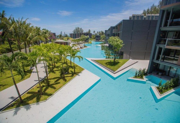 La Vela Khao Lak resort pool view. Gay travel to Thailand. Modern architecture, palm trees, blue water. 163584025.jpg