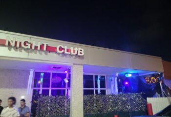 Club Boi, gay night club. Building facade with Night Club sign, decorated for Halloween. Gay travel advice.