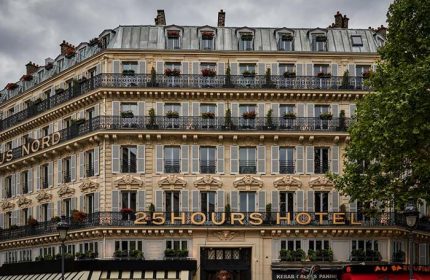 Facade of 25hours Hotel Terminus Nord, Paris. Gay-friendly hotel with balconies, shutters, and rooftop details. Parisian architecture.