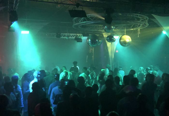 Inside Club Boi: a crowded gay club scene with disco balls and green lighting. Nightlife for gay men, image 3-18.jpg.
