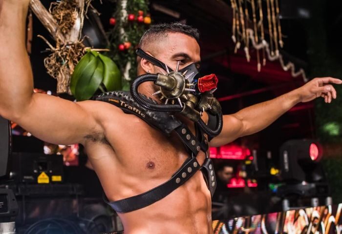 Shirtless man in leather harness & steampunk mask at SCORE, a gay bar. Gay men travel advice, nightlife, 3-22.jpg.