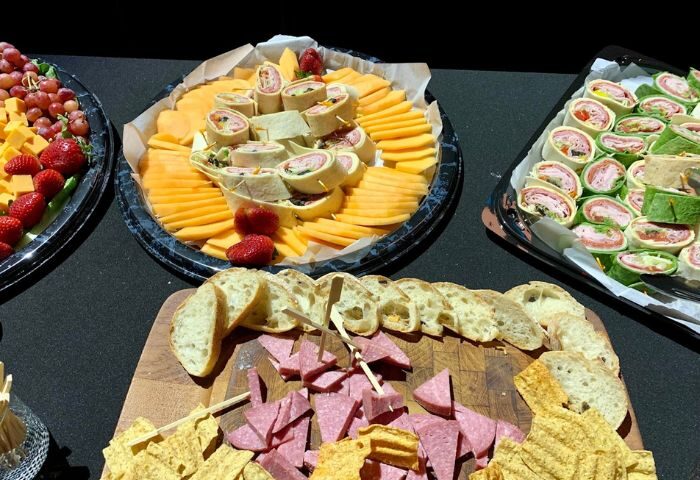 Hunters Wilton Manors catering: platters of wraps, cheese, fruit, bread, salami, and chips. Perfect for a gay travel event, party, or gathering.