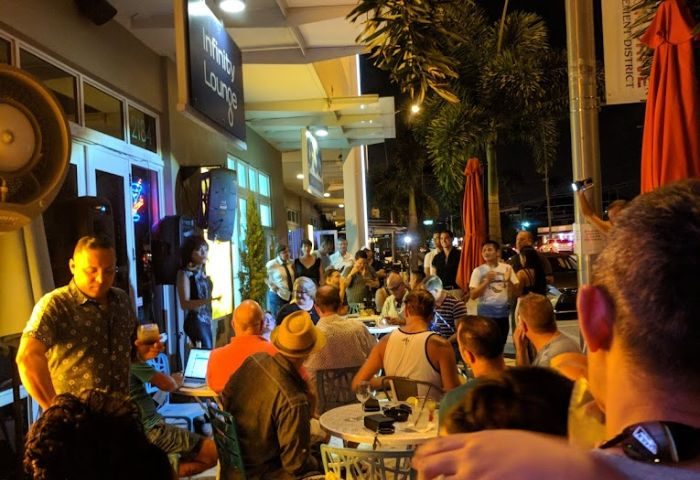 Infinity Lounge, gay bar. Outdoor seating at night, people gathered, enjoying drinks. Gay travel destination. 3-7.jpg