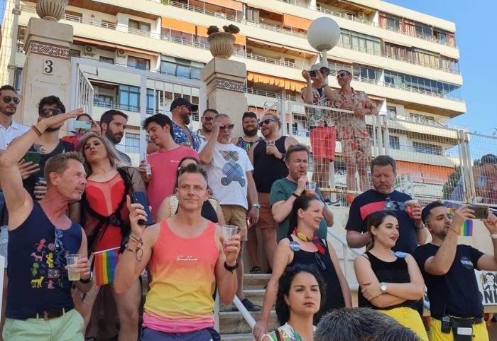 Gay Pride in Torremolinos. A group of people at 3 Monkeys Gay Bar, a popular gay-friendly spot in Torremolinos, Spain, celebrating Pride.