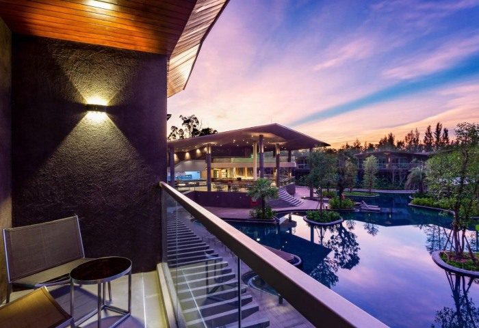View from Kalima Resort & Villas Khao Lak balcony. Pool and building at sunset. Gay travel destination. 317059077.jpg