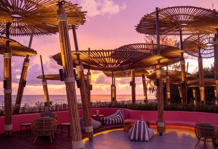 Apsara Beachfront Resort & Villa lounge at sunset. Tropical gay travel destination with stylish seating, beach view. 319179533.jpg