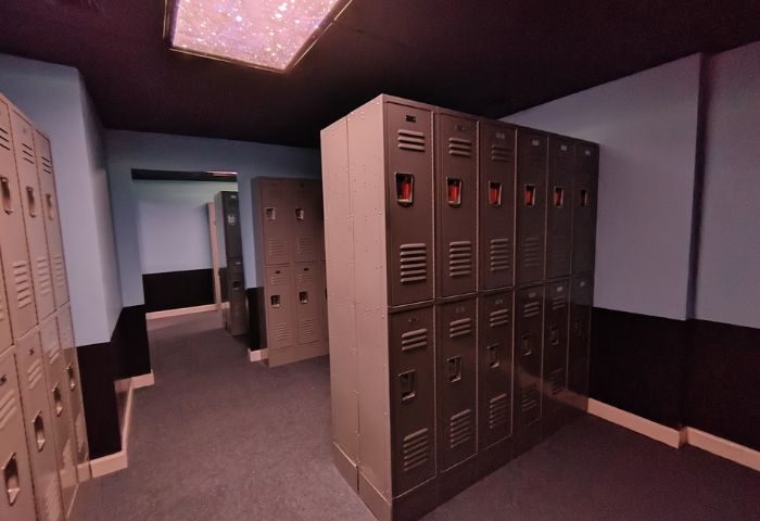 Locker room at Wilton Social Club. Gray metal lockers line the blue walls with black trim. Travel advice for gay men. 4-12.jpg