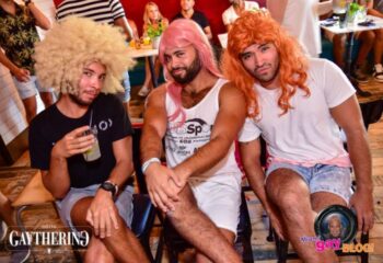 Hotel Gaythering bar scene: Three men in colorful wigs pose at a party. Gay travel advice, fun, and nightlife. Miami Gay Blog.
