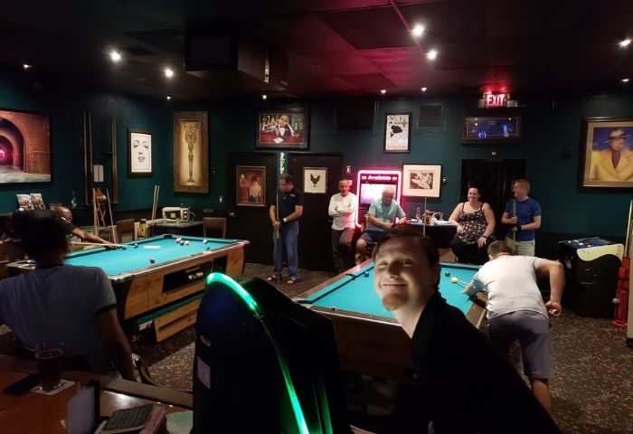 The Corner Pub: Gay men playing pool, socializing. A fun, relaxed atmosphere at this popular gay bar. Perfect for travel advice. File 4-2.jpg.