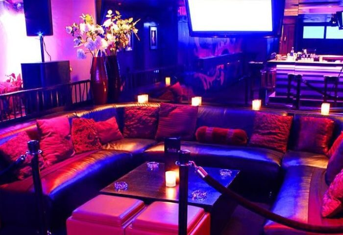 Gay bar Twist lounge area with leather couches, pillows, and candles. Nightlife scene, ideal for gay men travel advice. 4-27.jpg.