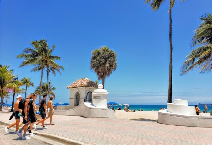 Infinity Lounge: Gay men on Fort Lauderdale Beach, Florida. Palm trees, blue sky, and ocean view. Travel advice for LGBTQ+ tourists.