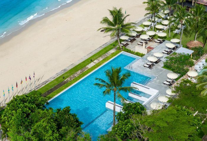 Apsara Beachfront Resort & Villa aerial view. Pool, beach, palm trees, and umbrellas. Gay travel advice for Thailand. 501967182.jpg