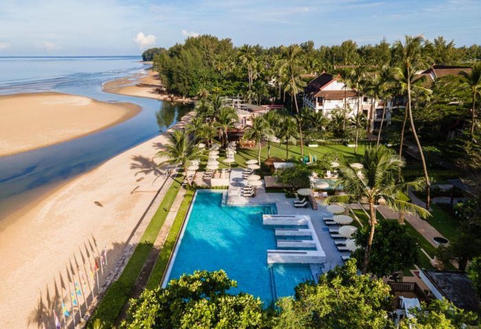 Aerial view of Apsara Beachfront Resort & Villa. Pool, beach, and lush greenery. Ideal gay travel destination. #beachresort #gaytravel