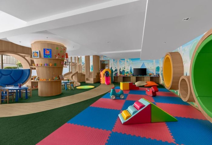 Courtyard Phuket Patong Beach Resort's kids club. Indoor playground with colorful soft play equipment, slide, and play structures for children.