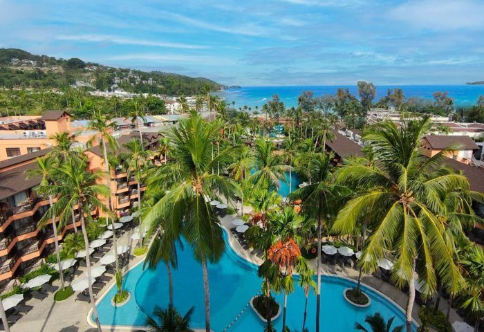 Courtyard Phuket, Patong Beach Resort view. Pools, palm trees, and ocean. Gay travel to Thailand. 545843529.jpg.
