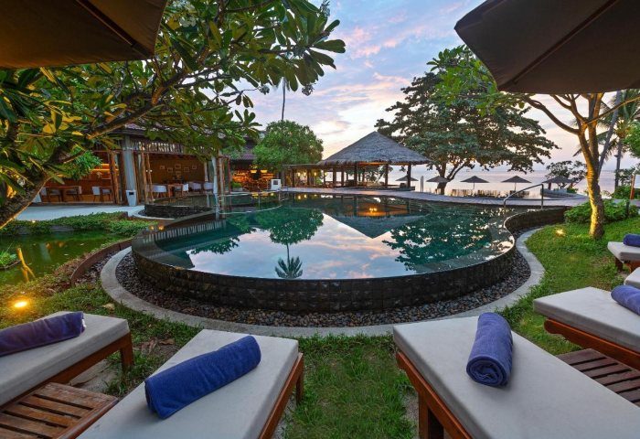 SAii Koh Samui Villas pool view. Serene tropical resort, perfect for gay travel. Loungers, calm water, and lush greenery. 564002184.jpg