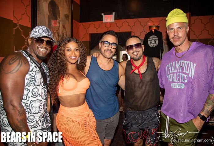 Gay nightlife at AKBAR. Group of stylish people at a party, celebrating LGBTQ+ community. Gay travel destination in Silver Lake, Los Angeles.