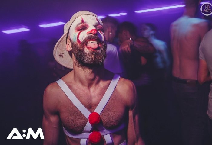 A:M Afterhours at Protocol, London. Man with clown makeup at gay after party on Friday/Saturday night. Best after-party in London.