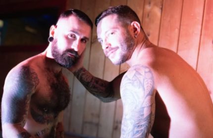Two shirtless tattooed men in Adam Sauna, Roma. Gay travel advice, men's wellness, and sauna culture in Rome.