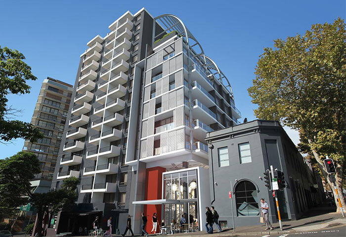 Adge Apartments, Sydney. Most booked luxury hotel with central location. Modern building with balconies, street view, ideal for gay travelers.