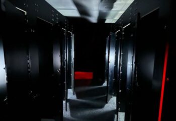Dark hallway with stalls at Adonis Health Club, Las Vegas. Gay cruising spot. Red light in the distance. Travel advice.