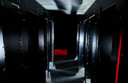Dark hallway with stalls at Adonis Health Club, Las Vegas. Gay cruising spot. Red light in the distance. Travel advice.