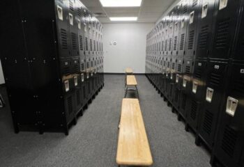 Adonis Health Club locker room in Las Vegas. Lockers line the walls with benches in the center aisle. Gay cruising spot.