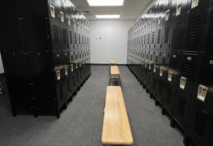Adonis Health Club locker room in Las Vegas. Lockers line the walls with benches in the center aisle. Gay cruising spot.