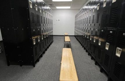 Adonis Health Club locker room in Las Vegas. Lockers line the walls with benches in the center aisle. Gay cruising spot.