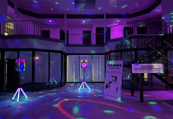 Adonis Health Club Las Vegas interior. Gay cruising spot with disco lights, dance floor, and multi-level layout. Gay travel advice.